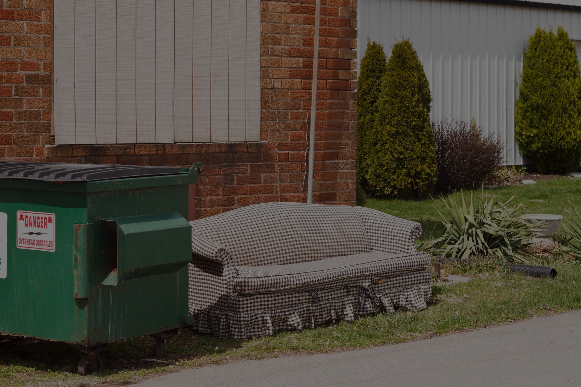 couch next to dumpster